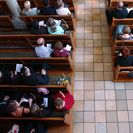 Overhead view of a congregation settled at church