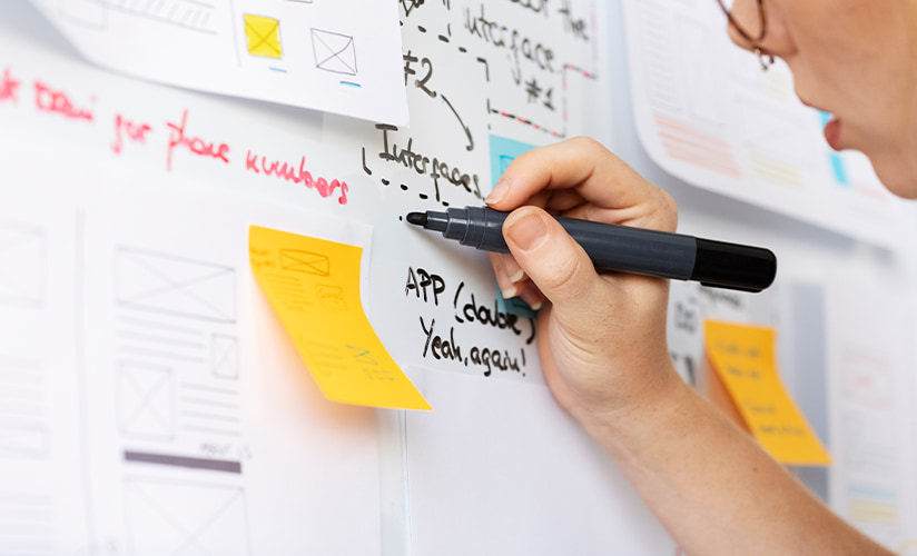 Close up of a hand mapping out website plans