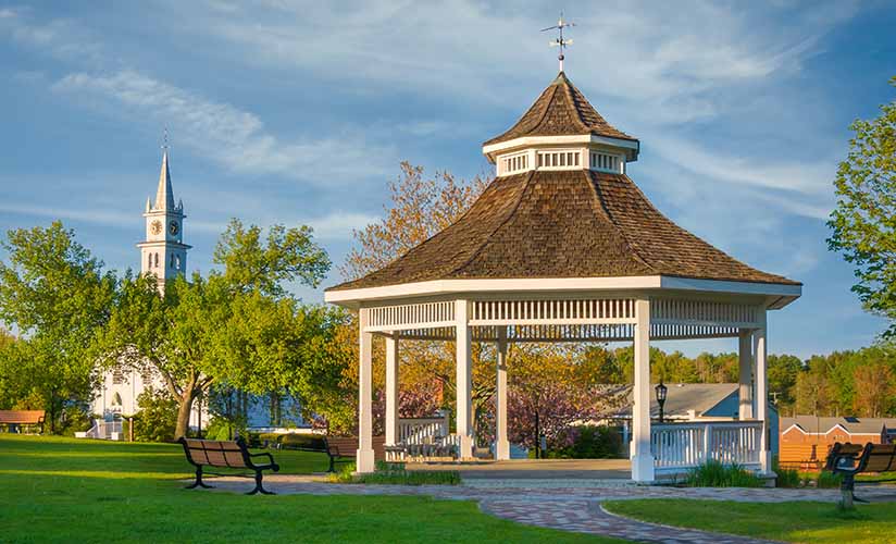 Outdoor pergola next to church building