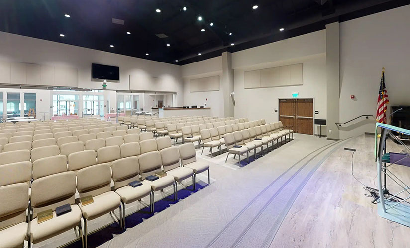 Bertolini chairs arranged into a wide traditional sanctuary layout