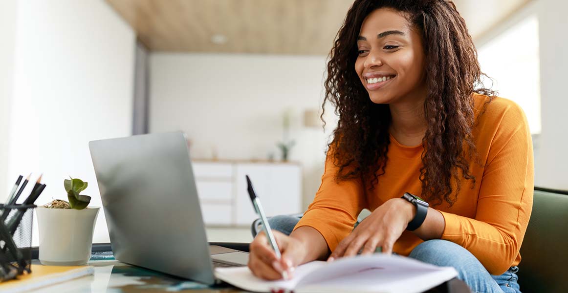 young church employee writing in notebook