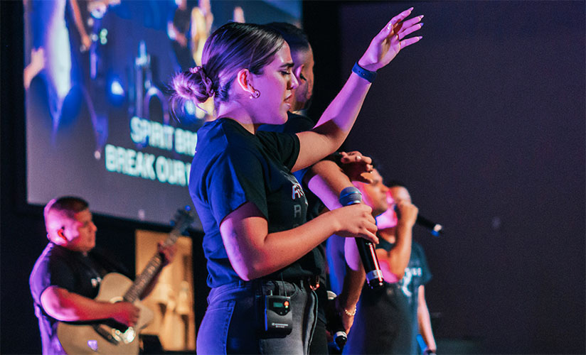 Singers on stage leading worship