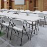 Brisa Rectangle Tables arranged in rows in a large multipurpose room
