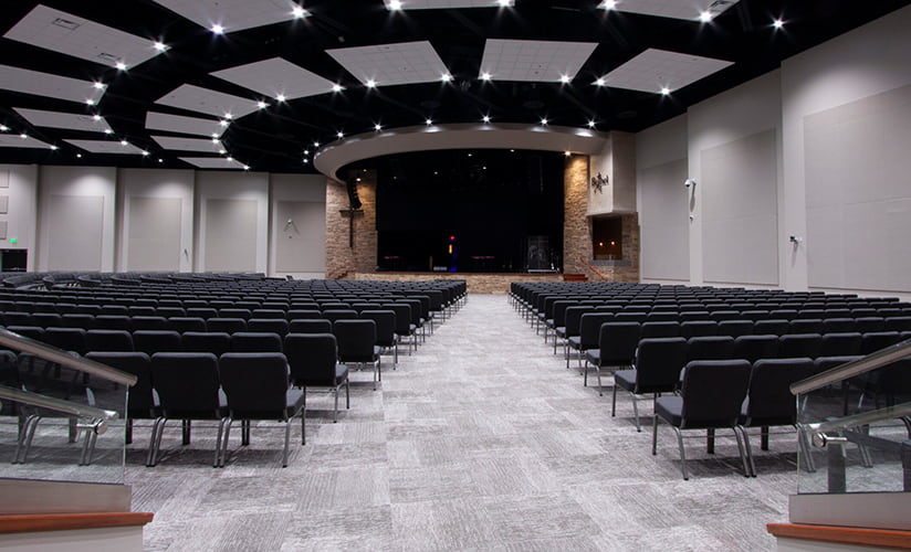 Modern, refreshed, large church hall will dozens of rows of chairs