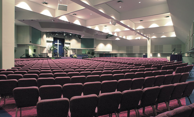 Large, modern worship space with many rows of chairs