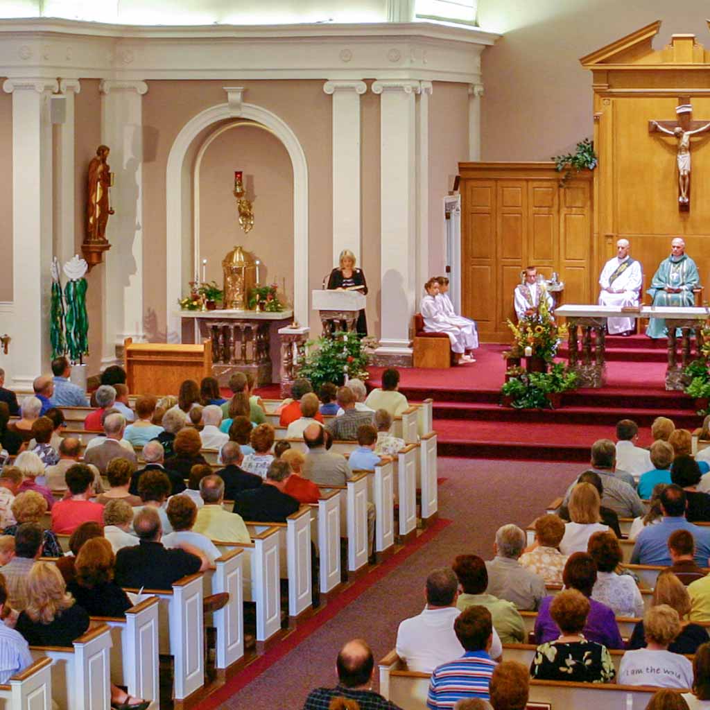 An overhead view of a congregation seated in an older church building